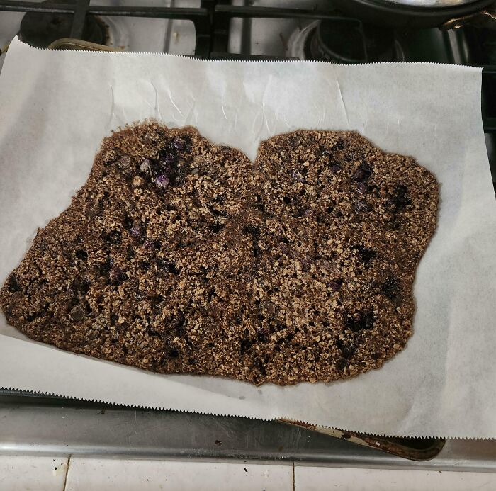 Overbaked and misshapen dessert on parchment paper, showing one of the many ways people managed to ruin dessert.