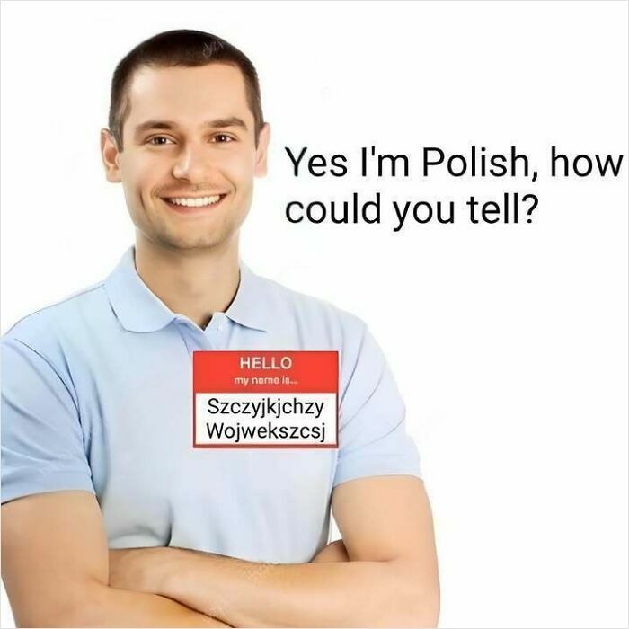 Smiling man with a name tag showing a complex Polish name, highlighting the Eastern European experience humor in meme format.