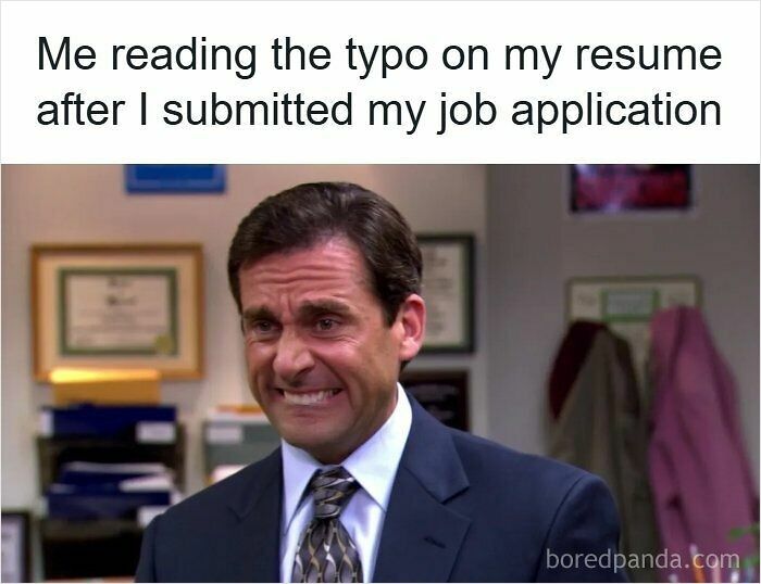 A man in a suit grimacing at a typo on his resume, capturing frustration with the hiring process in a resume meme.