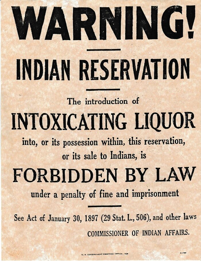 Historic US warning sign forbidding intoxicating liquor on Indian reservation, highlighting past legal restrictions.