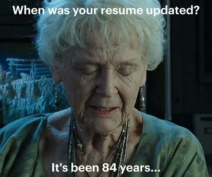 Older woman with eyes closed, captioned about resume update delay, illustrating resume memes for frustrated job seekers.