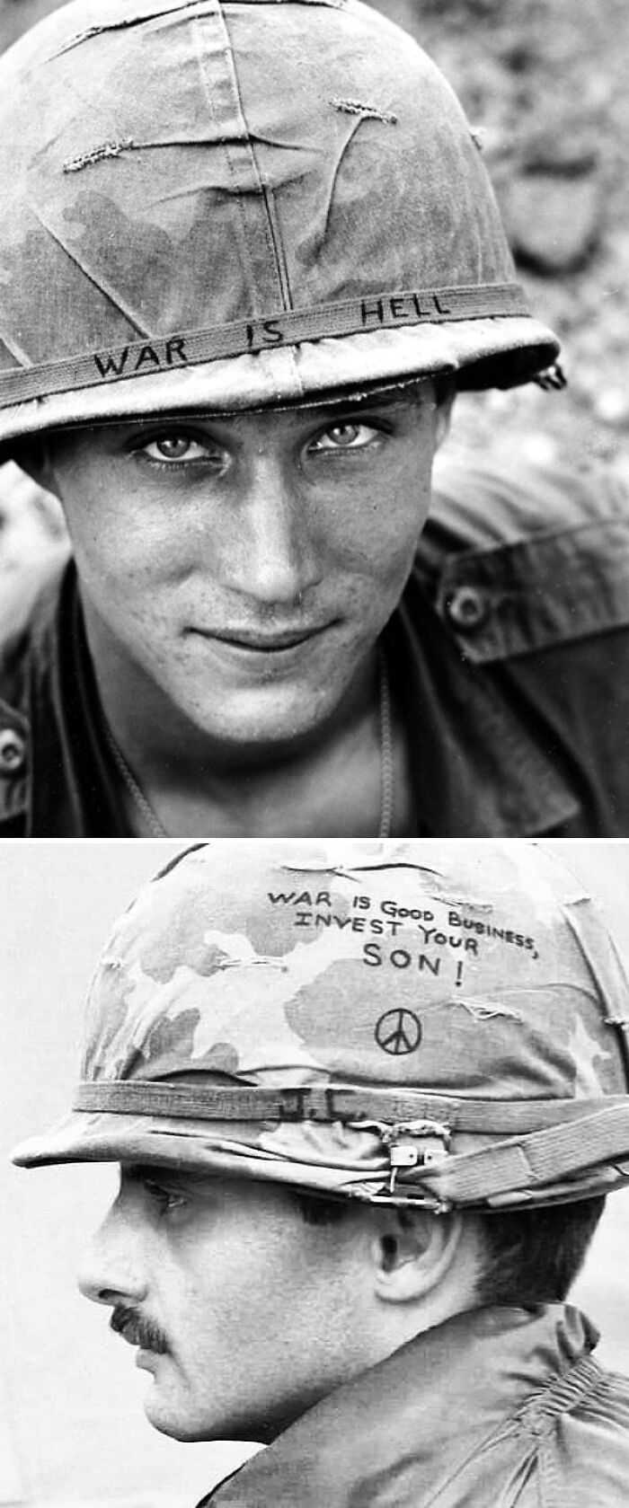 Two US soldiers wearing helmets with anti-war messages, highlighting unique perspectives in US history photos.