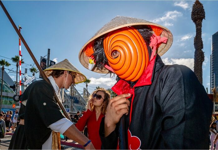 Street photos showing candid moments with people in costumes and everyday urban life captured outdoors.