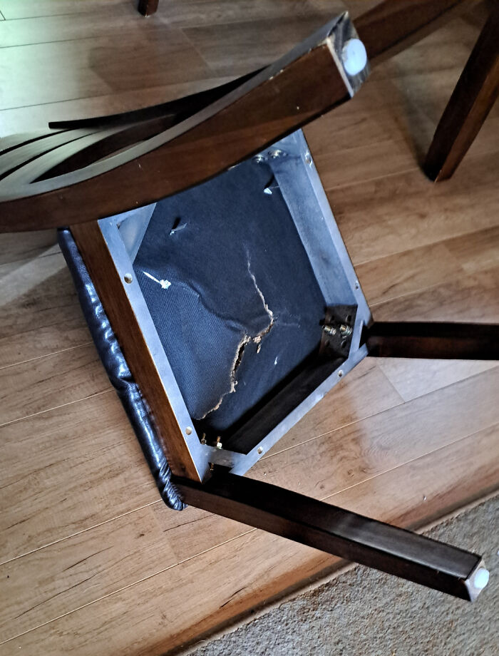 Broken wooden chair on the floor, illustrating weird teacher behavior witnessed in class by students.