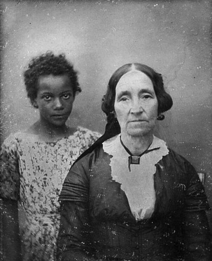 Black and white historical photograph of two women from different generations, depicting a world you'd hardly recognize today.