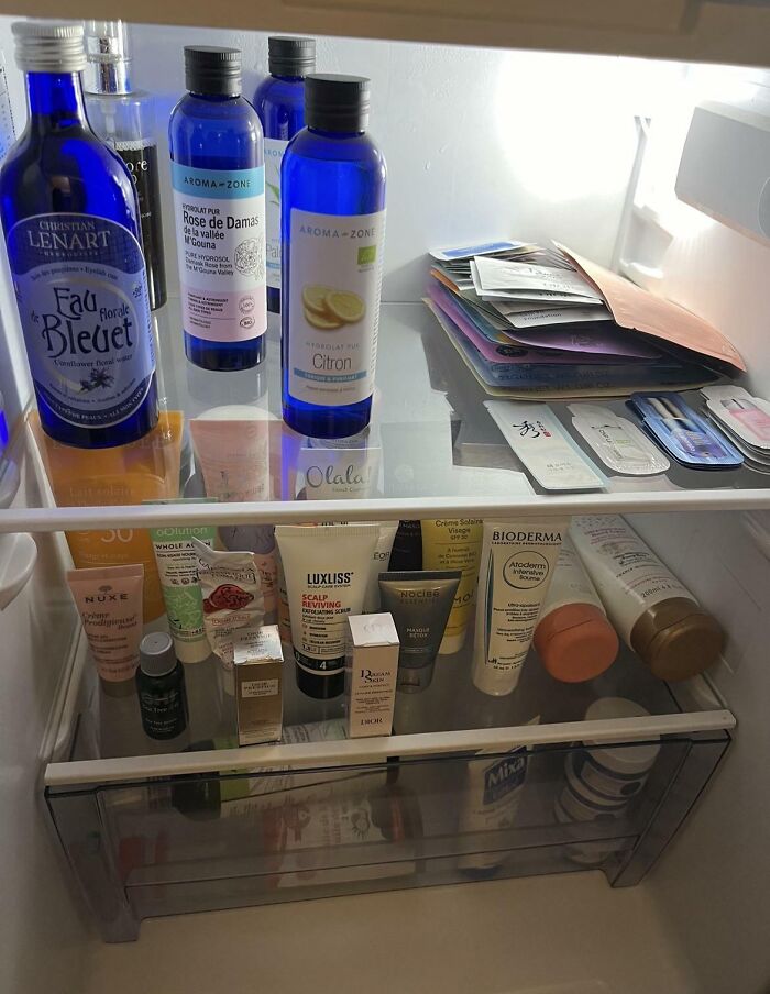 Skincare products and bottles stored in a fridge showcasing interesting fridge contents off the Pinterest aesthetic vibe.