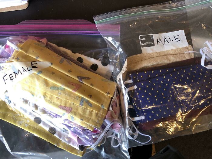 Two plastic bags containing face masks separated by gender labels male and female illustrating gendered nonsense.