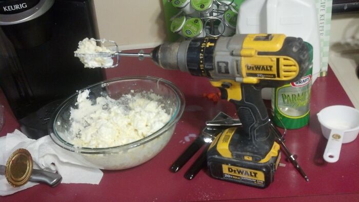 Cordless drill with beaters attached used to mix food, showcasing a failed DIY kitchen hack attempt.
