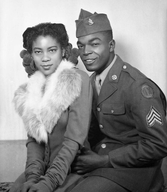 Black and white historical photograph of an African American soldier in uniform with a woman wearing a fur collar, depicting a world you'd hardly recognize.