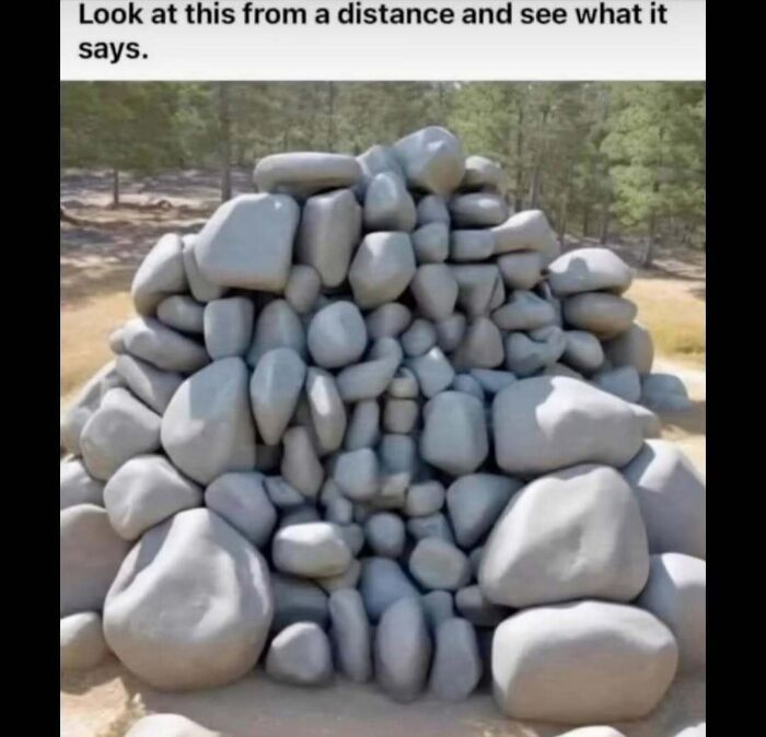 Pile of rocks arranged to form a hidden message, featured in a meme account explaining memes for those who don't get it