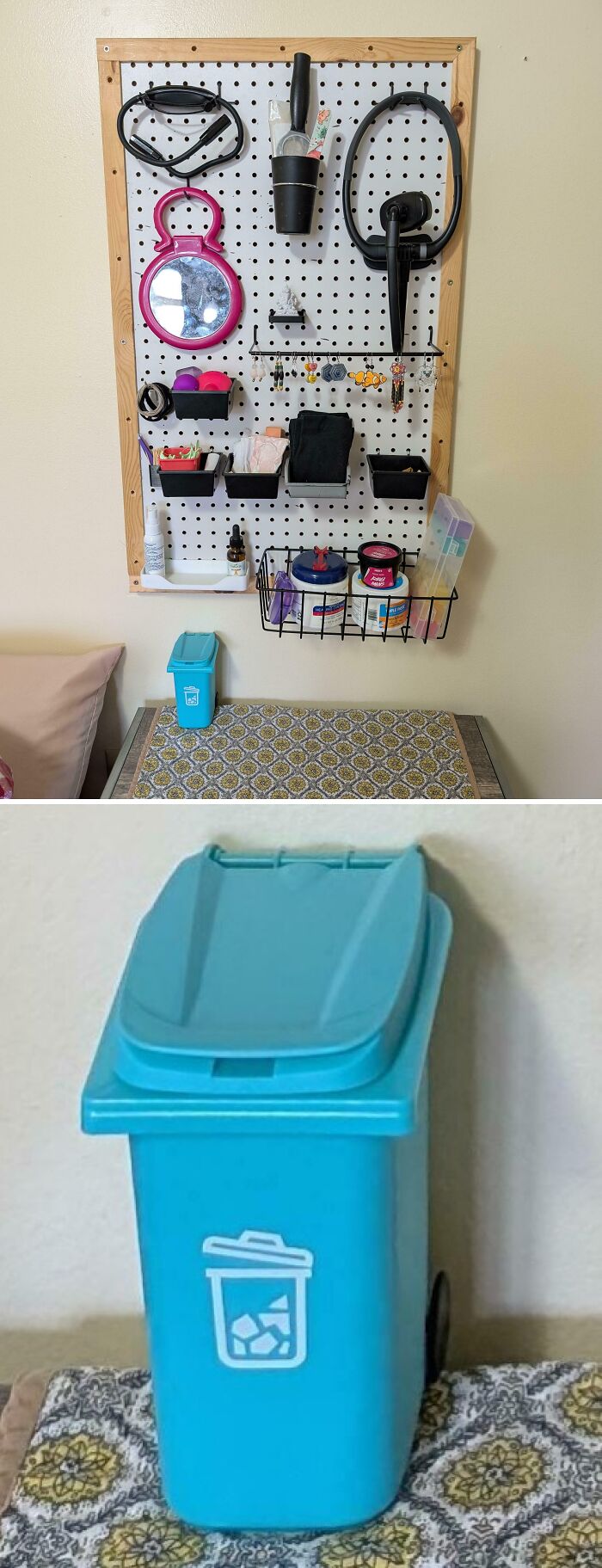 Neatly organized pegboard with personal items and a small blue recycling bin on a patterned table surface.