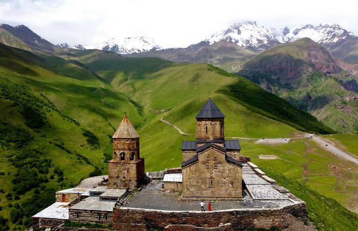 Stone carving of three historic figures on horseback, representing heritage of some of the oldest countries in the world.