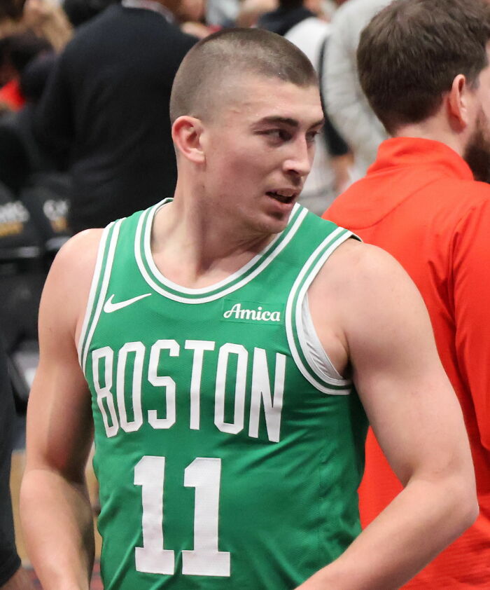 Payton Pritchard in Boston Celtics jersey number 11, on the court during a basketball game.