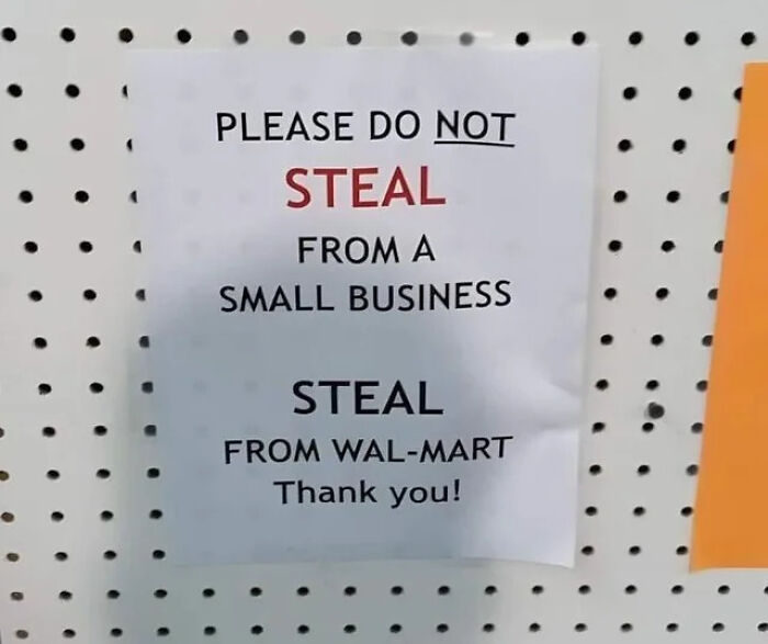Sign on a pegboard saying please do not steal from a small business but steal from Wal-Mart, highlighting posts that call out the world.