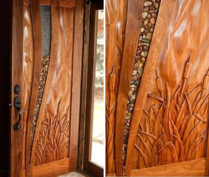 Intricately carved wooden door with nature-inspired design and embedded stones, showcasing impressive woodworking craftsmanship.