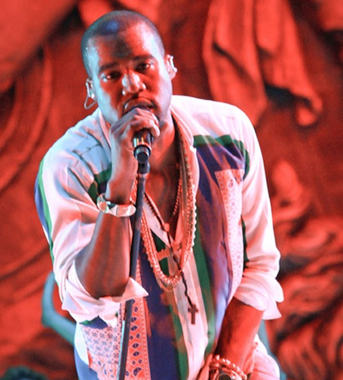 Male celebrity performing on stage with microphone, representing celebrities whose careers crashed and never recovered.