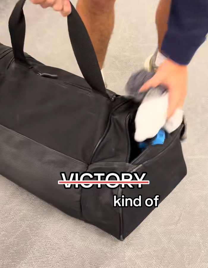 Passenger sorting underwear from a black bag at baggage claim, highlighting a viral carousel of shame moment. Passenger sorting underwear from a black bag at baggage claim, highlighting a viral carousel of shame moment.