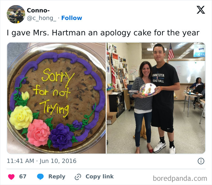 Apology cake with colorful flowers and humorous message alongside a student and teacher in a classroom setting.