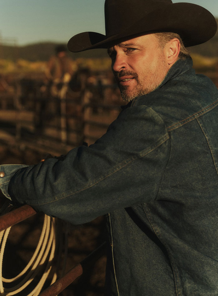 Man in denim jacket and cowboy hat at ranch, illustrating 2000s teen heartthrob unrecognizable appearance at 48. Man in denim jacket and cowboy hat at ranch, illustrating 2000s teen heartthrob unrecognizable appearance at 48.