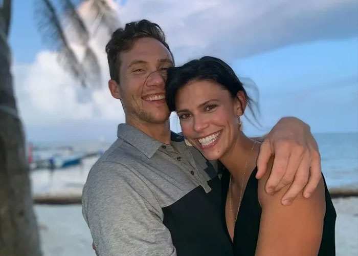 Couple smiling and embracing on a beach, related to ex FBI agent suggesting motive in Ohio dentist homicide case. Couple smiling and embracing on a beach, related to ex FBI agent suggesting motive in Ohio dentist homicide case.