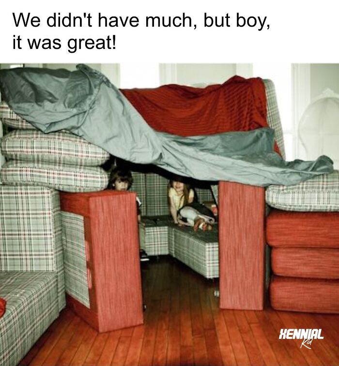 Kids playing inside a homemade fort made from couches and blankets, evoking nostalgic memories for xenials.