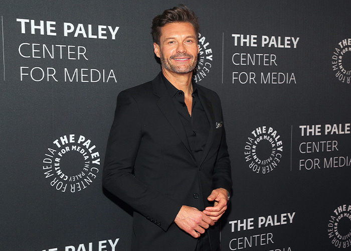 Ryan Seacrest at The Paley Center for Media event, showing an extremely skinny look on his face.