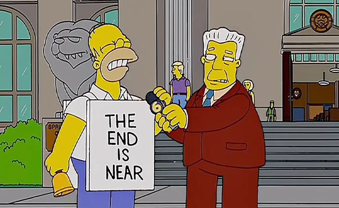 Homer holding The End Is Near sign while a suited man grabs his microphone, The Simpsons 2026 predictions Homer holding The End Is Near sign while a suited man grabs his microphone, The Simpsons 2026 predictions