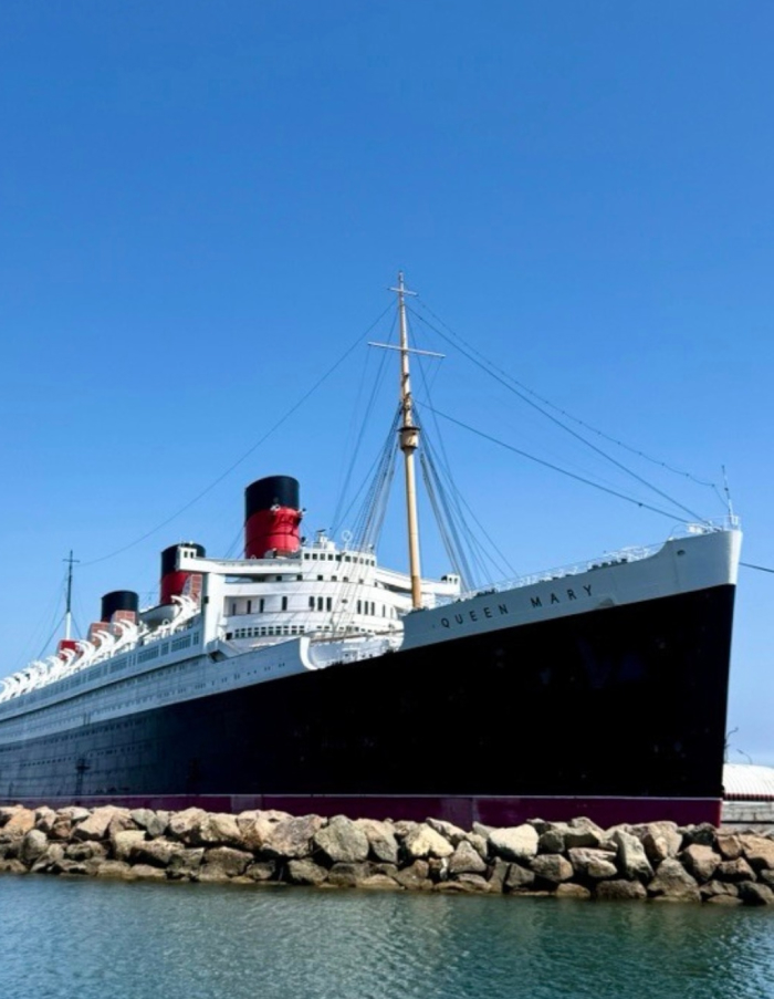 Queen Mary ship docked under clear blue sky, known as one of the most haunted places in America. Queen Mary ship docked under clear blue sky, known as one of the most haunted places in America.