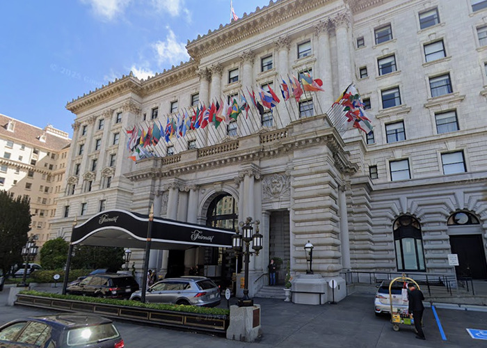Historic building entrance with multiple international flags, relating to new theory after 911 call code word in Victoria Jones case.