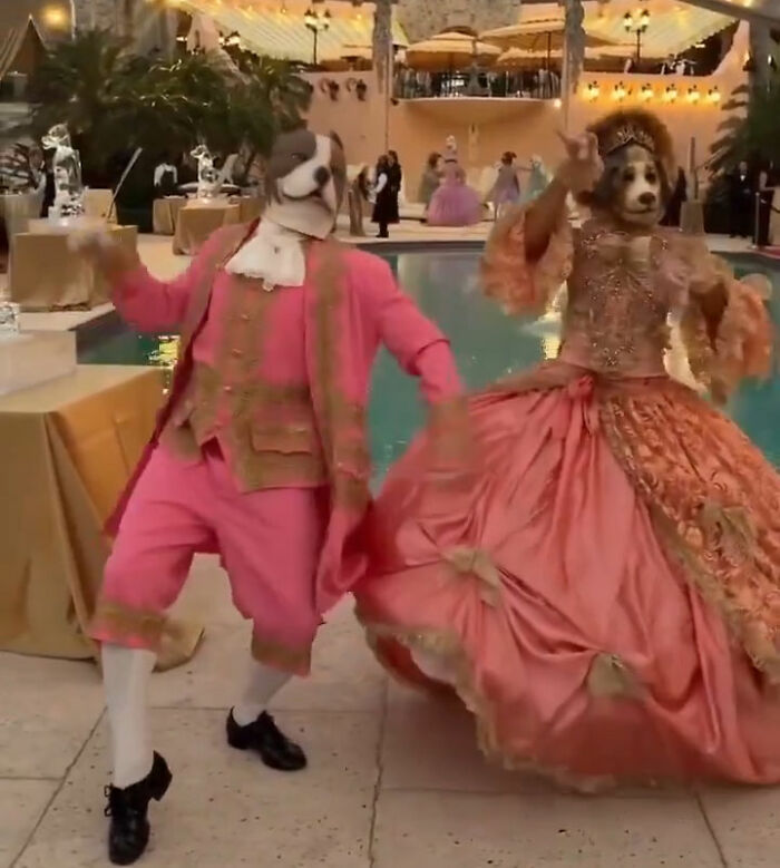 Two people in old-time costumes and dog masks dancing by a pool at a creepy Mar-a-Lago event. Two people in old-time costumes and dog masks dancing by a pool at a creepy Mar-a-Lago event.