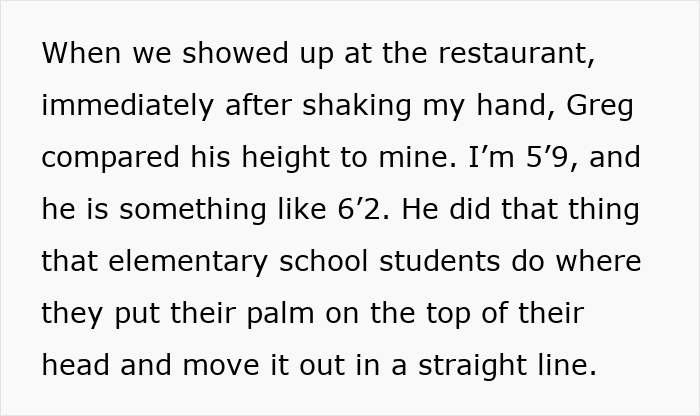 Two men comparing heights at a restaurant while engaging in friendly conversation and playful gestures.