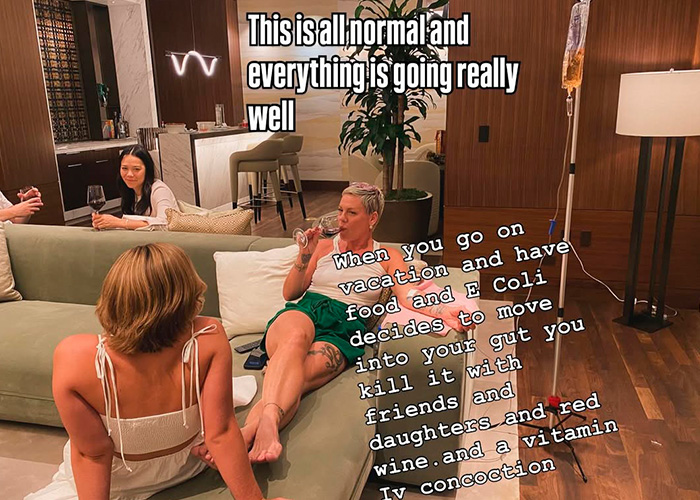 Pink relaxing with friends and drinking wine at home after spending New Year’s Eve alone in hospital receiving IV treatment. Pink relaxing with friends and drinking wine at home after spending New Year’s Eve alone in hospital receiving IV treatment.