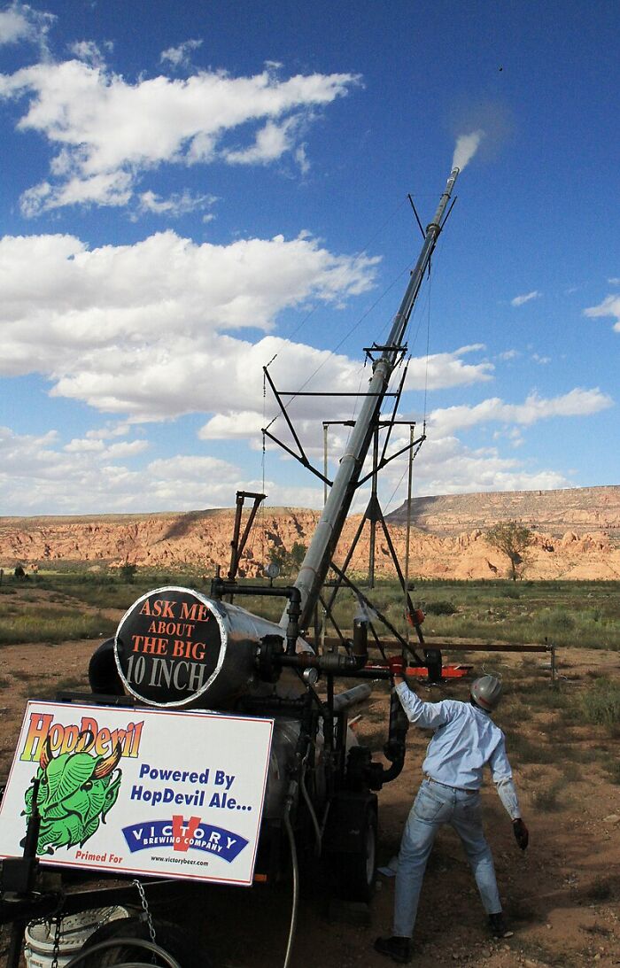 Unusual tradition involving a large outdoor contraption in a desert setting, highlighting strange world traditions.