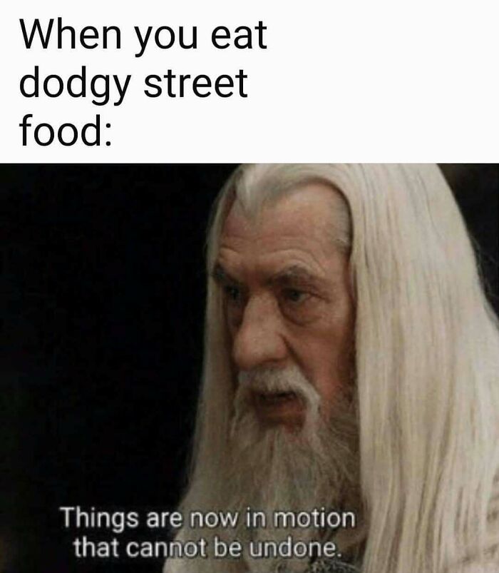 Meme showing a man with long white hair and beard, captioned about dodgy street food and travel memes humor.