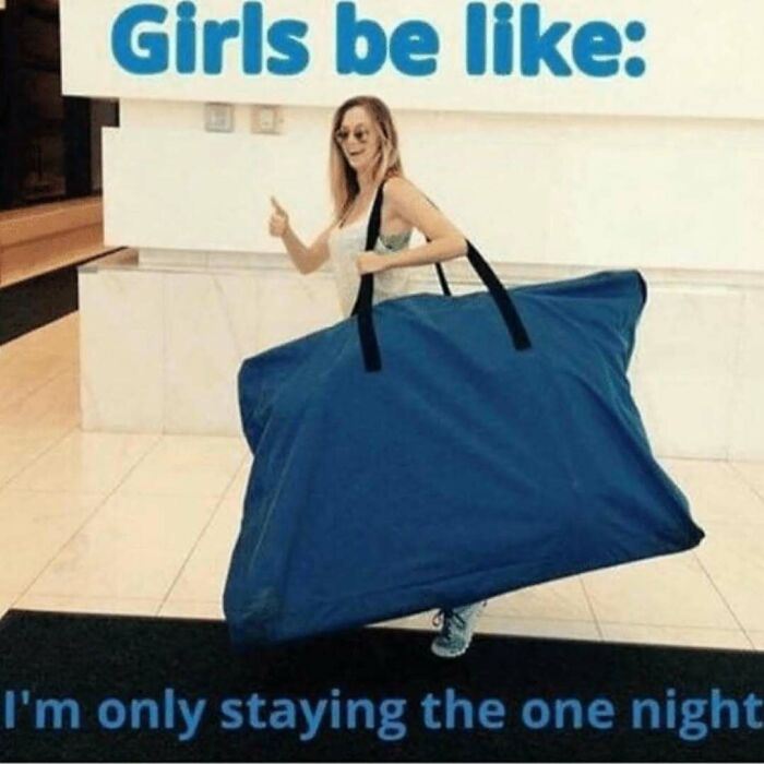 Woman carrying an oversized blue bag indoors, a funny travel meme highlighting travel humor and packing struggles.