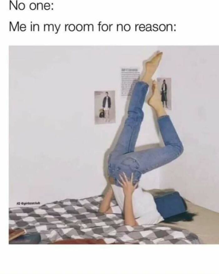 Person lying on bed with legs raised against the wall, depicting relatable memes about life as an introvert.