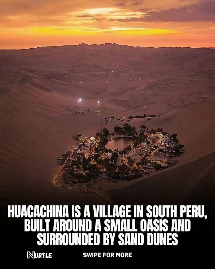 Aerial view of Huacachina village with a small oasis surrounded by sand dunes, illustrating random facts about unique places.
