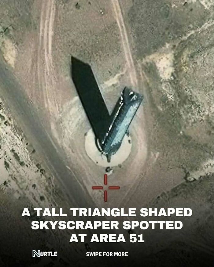 Aerial view of a tall triangle shaped skyscraper spotted at Area 51 in a random facts collection.