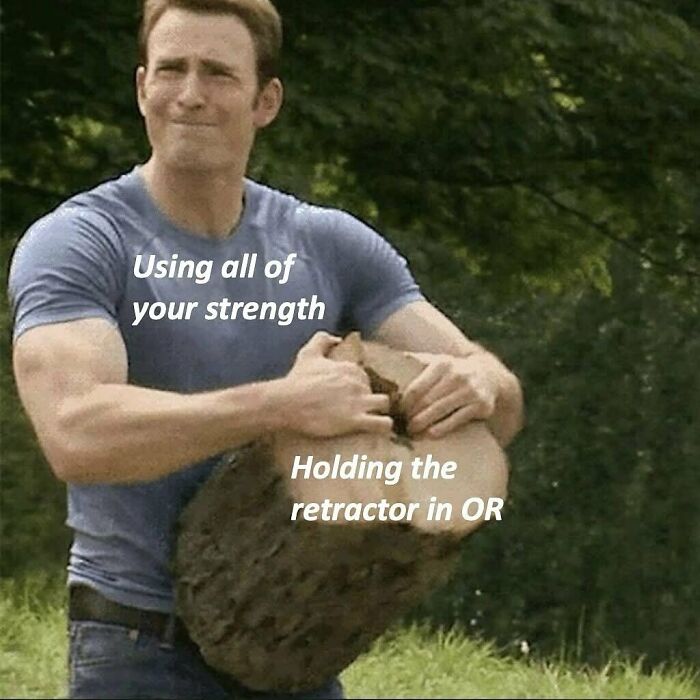 Man using all his strength to hold a heavy object, illustrating humor memes about healthcare and medical challenges.