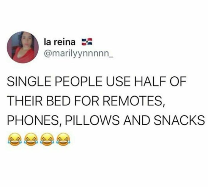 Funny meme text about single people using half their bed for remotes, phones, pillows, and snacks with laughing emojis.
