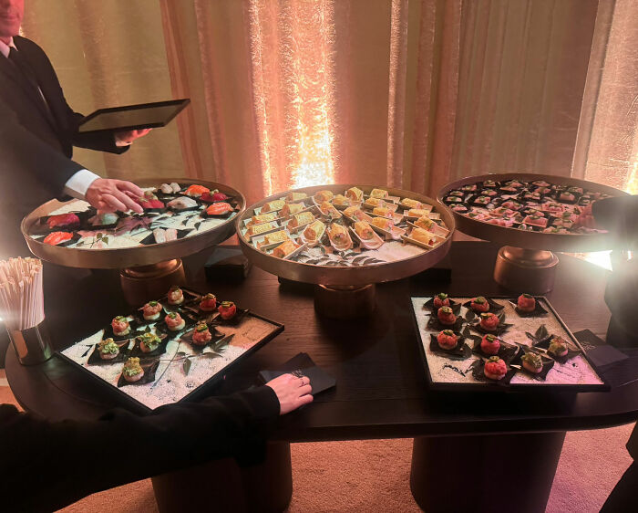 Golden Globes food display featuring sushi and appetizers served on trays, available to order on DoorDash delivery.