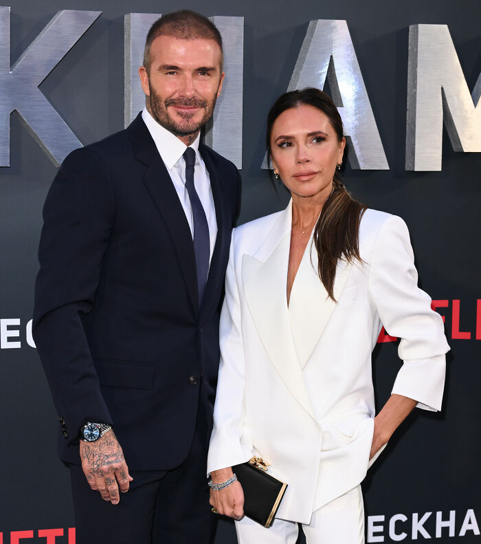 David and Victoria Beckham posing together at a red carpet event, related to Brooklyn Beckham's accusations controversy.