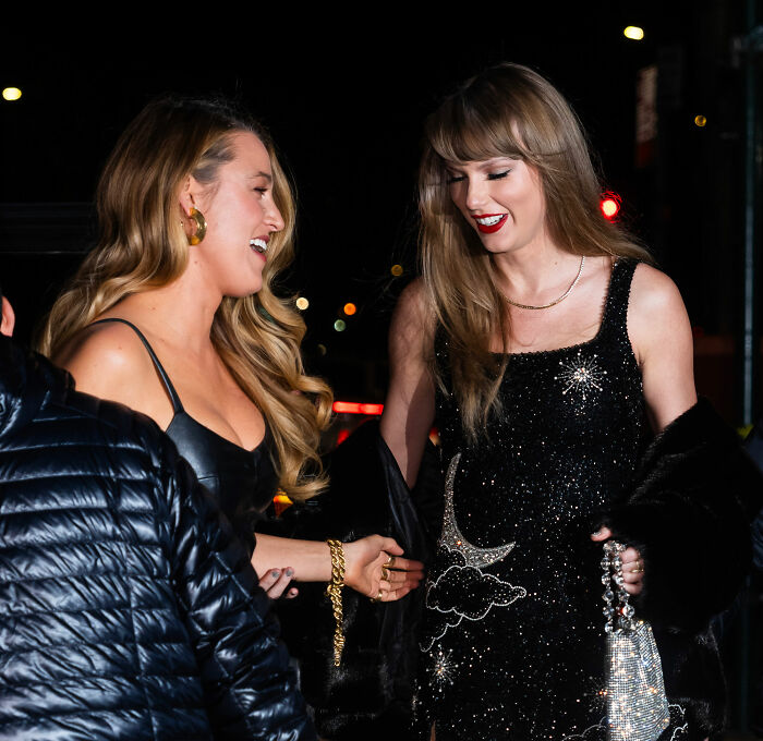 Taylor Swift smiling with a friend at night, highlighting Kim Kardashian's Taylor Swift comments sparking suspicion. Taylor Swift smiling with a friend at night, highlighting Kim Kardashian's Taylor Swift comments sparking suspicion.