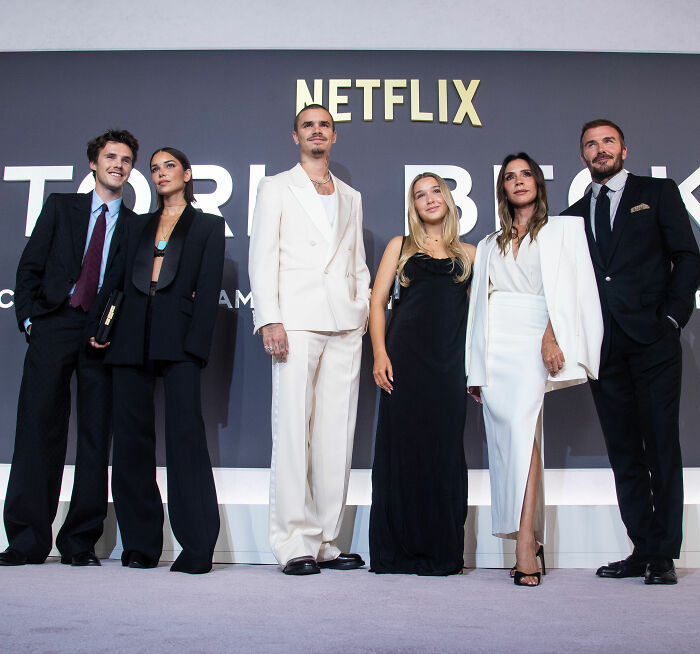 Brooklyn Beckham and family dressed formally at a Netflix event amid biting accusations against parents controversy.