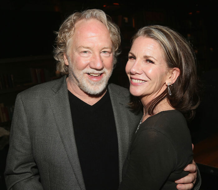 Melissa Gilbert posing with a man, smiling at a social event, sparking outrage over Instagram fridge tour controversy.