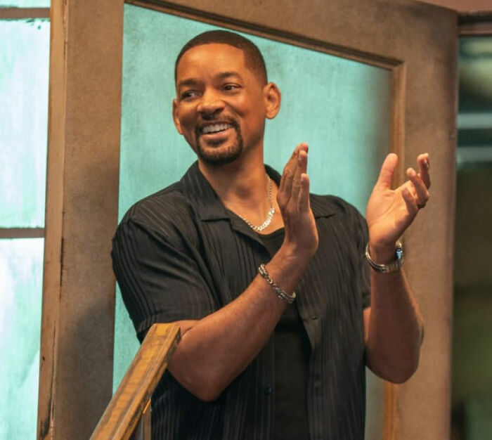 Will Smith smiling and clapping in a casual setting amid accusations involving harassment and grooming in a lawsuit. Will Smith smiling and clapping in a casual setting amid accusations involving harassment and grooming in a lawsuit.