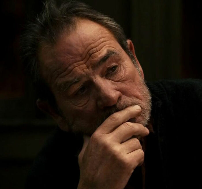 Tommy Lee Jones in a dark setting, looking pensive with hand on chin, related to daughter Victoria story. Tommy Lee Jones in a dark setting, looking pensive with hand on chin, related to daughter Victoria story.