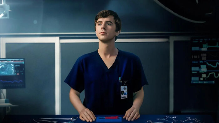 Young male actor in medical scrubs standing confidently in an operating room, highlighting one disorder portrayal. Young male actor in medical scrubs standing confidently in an operating room, highlighting one disorder portrayal.