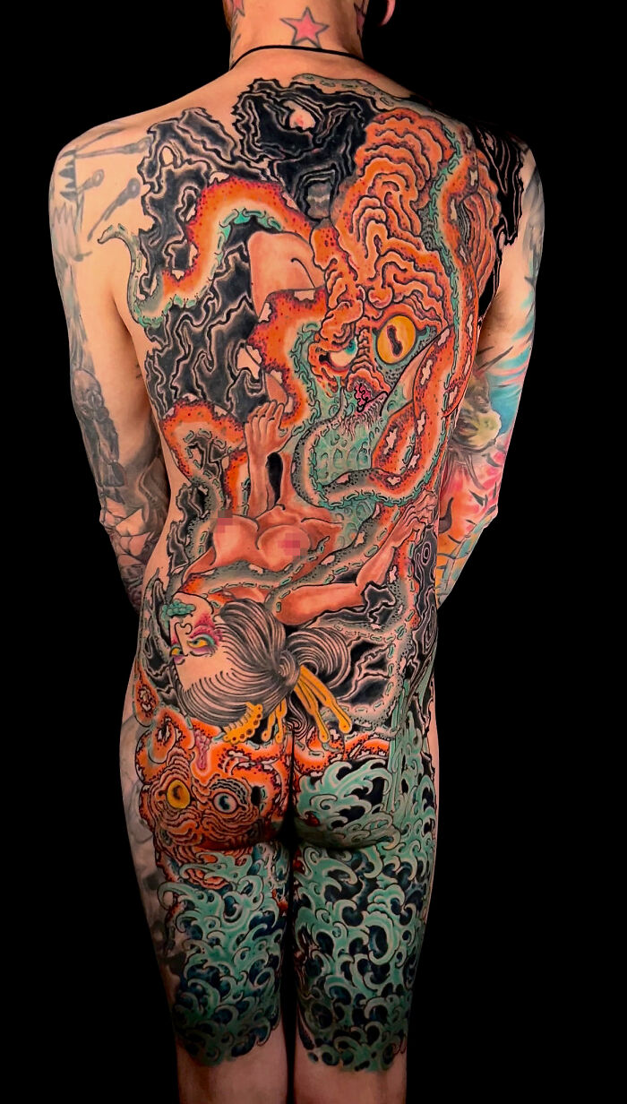 Full back tattoo featuring a colorful, intricate design of an octopus and a woman, showcasing cool tattoo art.