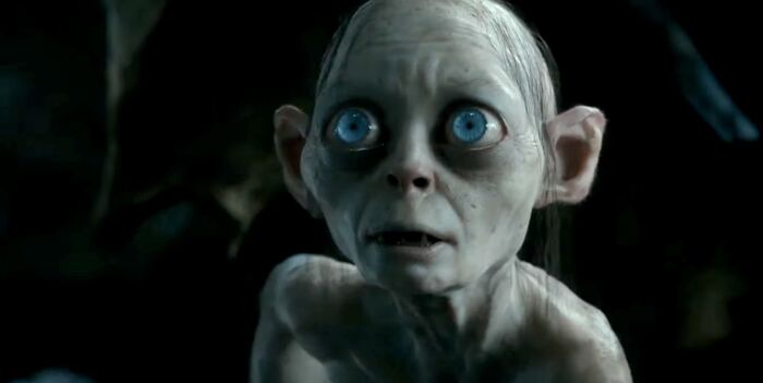 Gollum with wide blue eyes in a dark setting, representing a famous villain for purity of evil judgment.